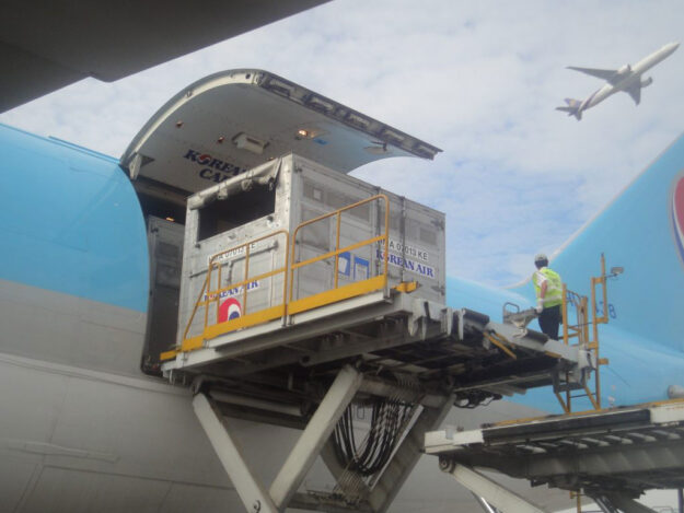 Cargo box being loaded on a plane.