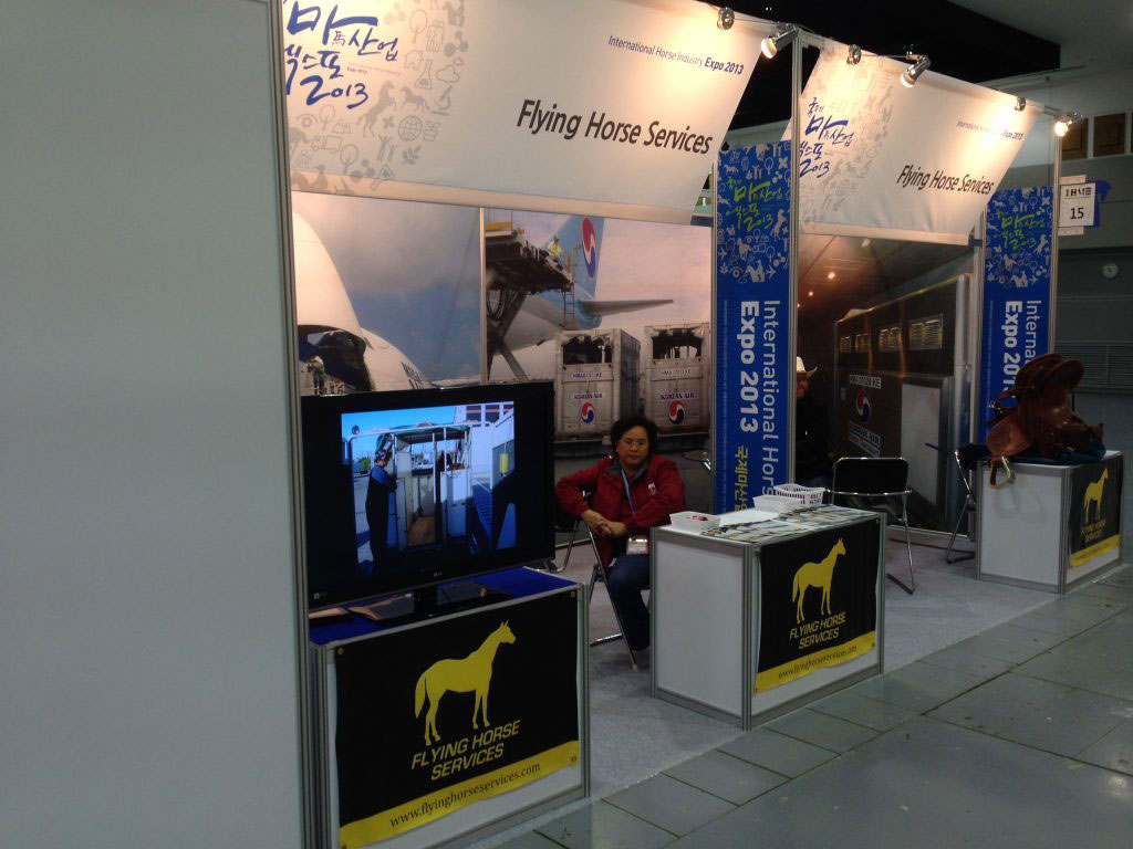 Flying Horses Services booth at a trade show.