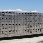 Animals in a diesel truck at loading dock.