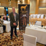 Peter Calnan next to his banner.